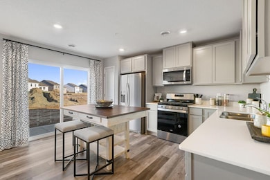 Welcome to the Finley! DR Horton's newest 3-bedroom townhome features an open concept main level kitchen space. Photo of model, colors and finishes may vary.