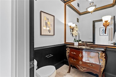 Bathroom featuring vanity and wainscoting