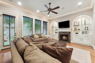 Cozy living area with marble-surround fireplace, c