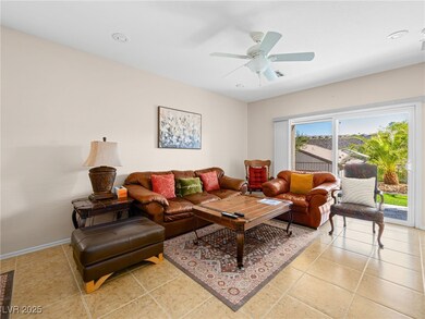 Living room with a ceiling fan, recessed lighting,