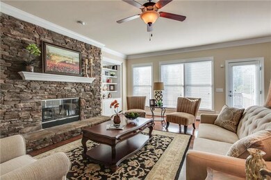 Gather around the fireplace and enjoy the beautiful view as (hopefully) the snow falls in the woods behind.......
