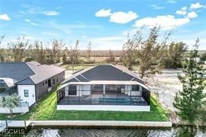 Rear view of house with a water view