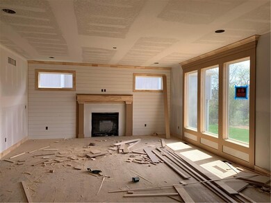Shiplap accents the fireplace wall