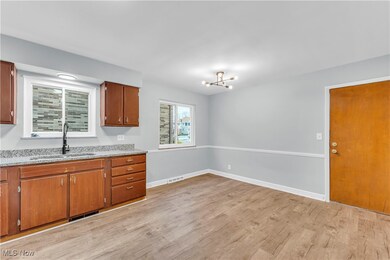 Kitchen featuring light wood-type flooring and sink