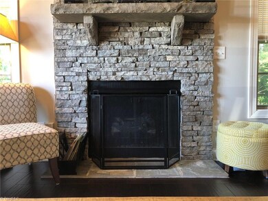 Stacked stone gas log fireplace