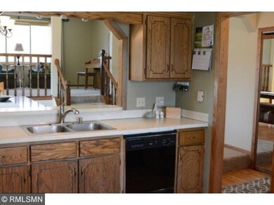A buffet ledge opens to the dining area from the k