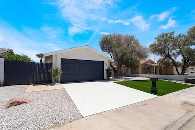 Ranch-style house featuring stucco siding, drivewa