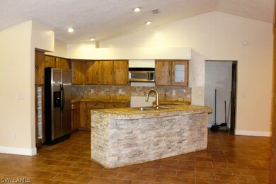 Fantastically finished Island Kitchen with ornate tile work and rough hewn cabinetry