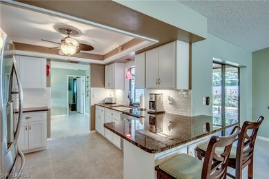 This is a WOW! kitchen...granite counters, tile backsplash, soft close cabinets and drawers, breakfast bar, pocket pass through slider window, stainless steel appliances...