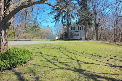 The house is set back far away from the road.