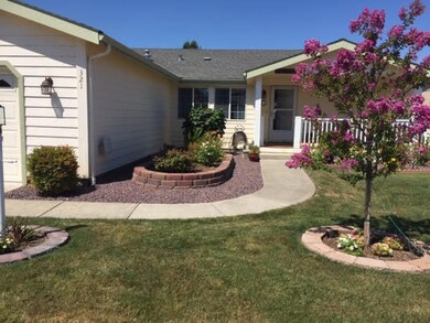 Front with crepe myrtle tree