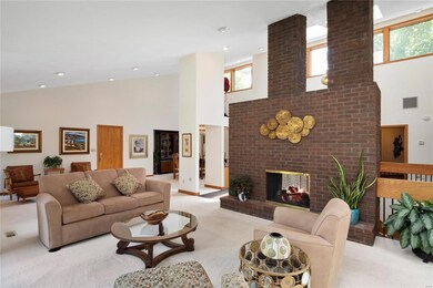 Living room on main level, see thru gas fireplace