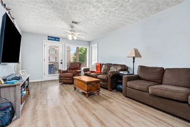 Spacious great room opens to covered balcony