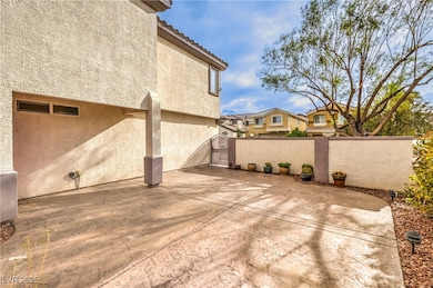 View of courtyard with a gate and fence