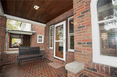 Hardwood ceiling, gorgeous tile floor on front por