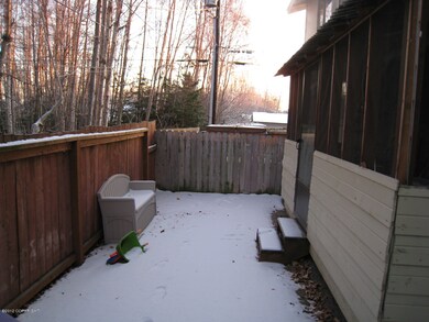 Fenced Back Yard With Sunroom