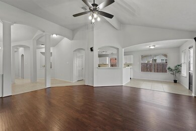 The spacious family room features soaring ceilings