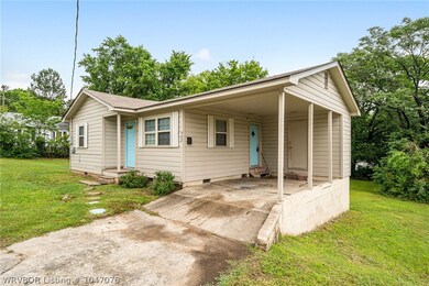 Single car port and adjoining laundry room.