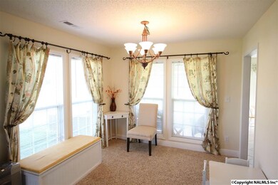 THIS ROOM IS CURRENTLY USED AS A SITTING AREA BUT CAN EASILY MAKE A GREAT OFFICE OR FORMAL DINING ROOM!