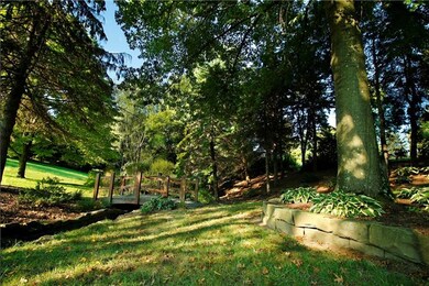 Relax in the shade garden or cross the charming br