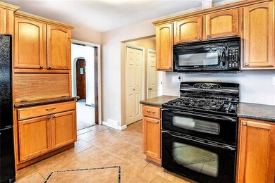 Maple Cabinets, Gas Range with an additional warmi