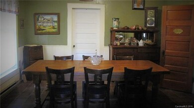 Large dining room, beadboard walls and ceiling.