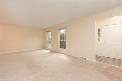 Foyer with new flooring.  Coat closet to your righ