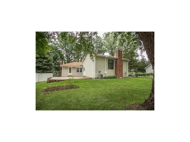 Large, flat backyard with mature trees. Newer pave