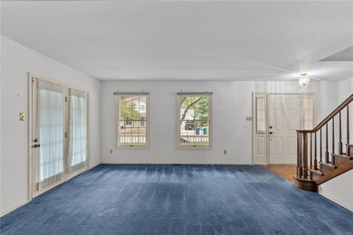 Well sized living room with access to the wrap-aro