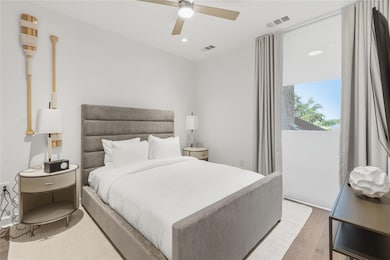 Bedroom featuring wood finished floors, recessed lighting, and ceiling fan