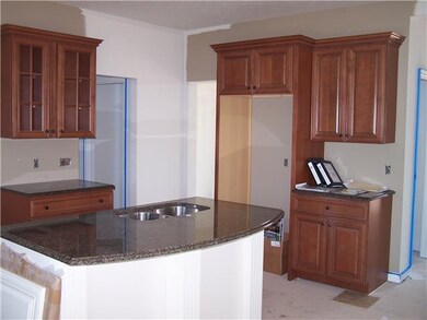 Kitchen Large kitchen island w/ granite counters a