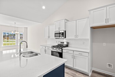 Kitchen with stainless steel appliances, sink, vau