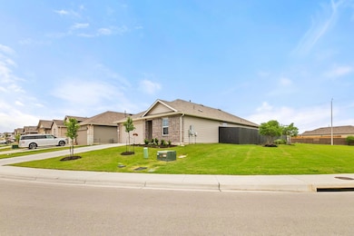 Ranch-style house featuring a front lawn, drivewa