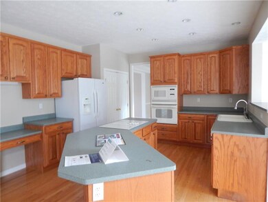 The Kitchen area has a double oven and a cooktop o