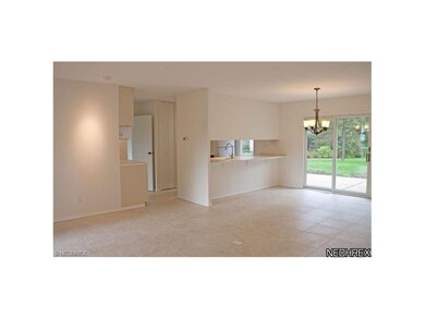 Open family room leads to backyard patio. Stools c