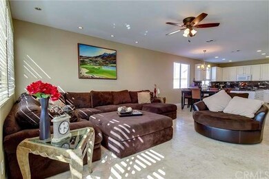 Family Room to Kitchen shows off the Travertine fl
