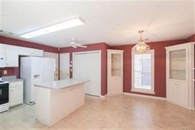 Open Kitchen with bar/island facing Dining area
