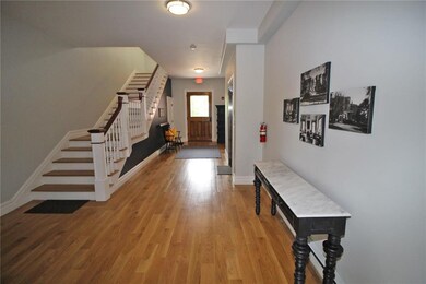 Hallway to Unit 3 facing back door to Prairie Aven