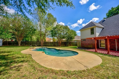 View of swimming pool with a pergola, pool water f