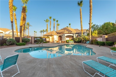 Community pool featuring a patio area