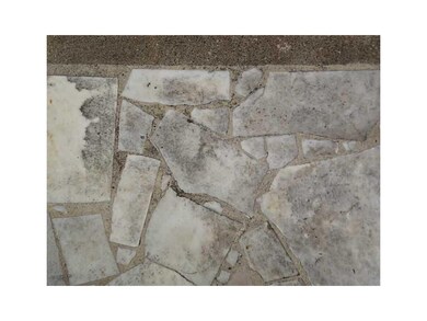 Entryway. Inset marble on front porch