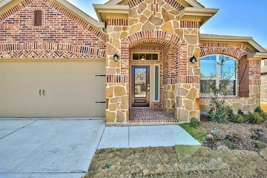 Entrance to property featuring a garage