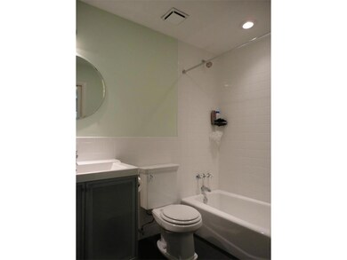 Bathroom featuring vanity, shower / bath combinat