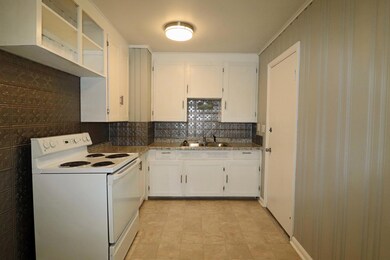 Kitchen has pressed tin backsplash