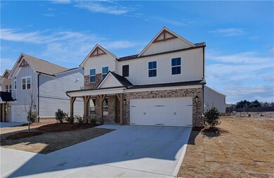 View of front of property with brick siding, board