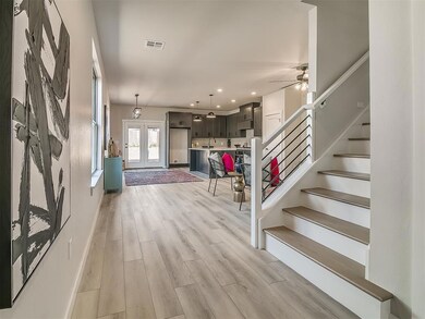 Entryway featuring french doors, ceiling fan, and 