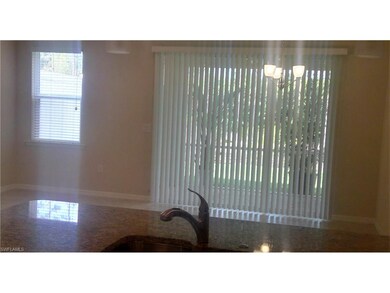 Ready for move in with windows throughout home covered with blinds, lovely light fixtures and fans.