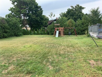 Adjoining lot on the inside of the privacy trees a