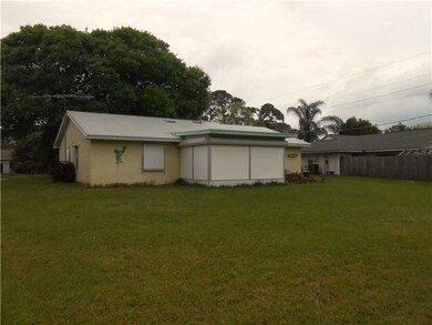 Exterior Back. metal room and large screened porch