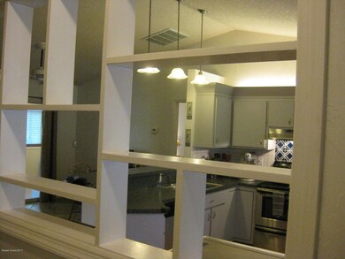 Front entry way with view to kitchen